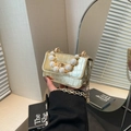 Gold crocodile texture mini crossbody bag with pearl handle and delicate metal chain - Gold