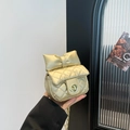 Mini bolso bandolera acolchado dorado con lazo grande y cierre giratorio metálico - Dorado