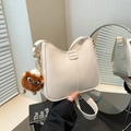 White semi-circle leather shoulder bag with a cute brown plush monster pendant accessory - With Pendant / Off White