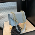 Light blue crossbody bag with woven texture lid and golden chain strap for women - Blue