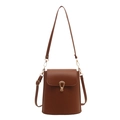 Minimalist dark brown bucket bag with smooth leather finish and golden arch buckle - Brown