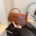 Brown crocodile pattern mini handbag with gold Miss Mini lettering and knotted strap - Brown