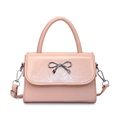 Pink crossbody bag with a silver metal bow and polished embossed leather finish - Pink
