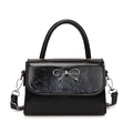 Elegant black glossy small square handbag with silver bow detail and detachable strap - Black