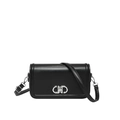 Minimalist black leather crossbody bag with silver interlocking buckle and adjustable strap - Black