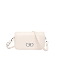 Creamy beige PU leather crossbody bag with elegant silver clasp and adjustable strap - White