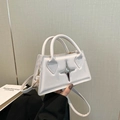 Minimalist white trapezoid handbag with silver star detail and detachable shoulder strap - White