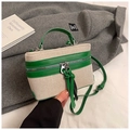 Detail of dual zipper closure and green leather trim on contrast weave box bag - Green