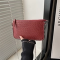Fashionable wine red woven crossbody bag with silver rivets and metallic chain strap - Red