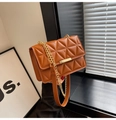 Detail of caramel brown quilted PU leather crossbody bag with gold metal buckle - Brown
