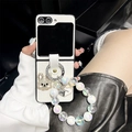 Detail of white leather Z Flip case with rhinestone rabbit charm and pearl wristlet strap - Woven-Love Rhinestone Rabbit-Laser Bead Chain-Off White / Samsung ZFlip3