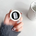 Chic phone grip featuring a rectangle cat-eye stone inlay held by hand with elegant nails - Round Long Cat Eye