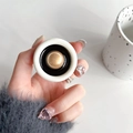 Detail of round white phone socket grip with elegant gold dome center and black trim - Round Champagne Pearl