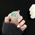 Close-up of clear resin phone grip featuring green planet design and glitter stars - Constellation Green Saturn