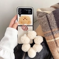 Detail of plush bear embroidery and pearl wristband on beige folding phone case - Samsung Z Flip 3 / Cream White Weave (With Plush Ball Pearl Chain)
