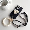 Detail of black iPhone case with pearl heart stand, pearl wrist strap and leather strap - Black / iPhone 7/8/SE 2020