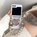 Detail of coffee mirror heart phone case for Z Flip with elegant beaded hand chain - Grey Brown / Samsung ZFlip3