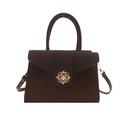Minimalist deep brown grainy tote bag with a golden floral lock and adjustable strap - Brown