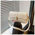 Detail of a creamy white baguette shoulder bag with gold metal buckle and matte texture - White