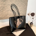 Minimalist black large capacity bucket bag with glossy texture and tassel charm - With Pendant / Black