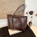 Vintage dark brown tote bag in oil wax leather with a golden bell charm detail - With Pendant / Coffee