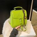Neon green leather tote backpack with silver buckle and braided rope charm detail - Green With Pendant