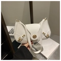 Detail of white faux leather underarm bag with gold turn-lock and metallic rivets - White