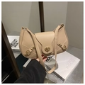 Detail of apricot moon bag featuring golden rivets and metal twist lock closure - Khaki