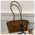 Detail of brown faux leather tote with knotted straps and gold hardware accents - With Pendant / Brown