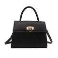 Elegant black leather trapezoid handbag with gold circular lock and adjustable strap - Black