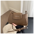 Detail of vintage brown leather shoulder bag with white Fashion & Bags text logo - Brown