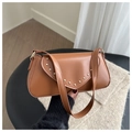 Detail view of the vintage brown PU leather shoulder bag with gold rivet decorations - Tan