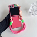 Detail of rose red folding phone case with 3D frog, flower, and woven lanyard - Rose Red / Huawei Pocket 2