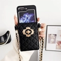 Detail of black quilted leather phone case with golden clasp and pearl chain strap - Samsung ZFlip3 / Black