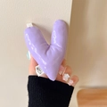 Close-up of a padded purple heart phone grip with glossy quilted leather texture - Warped Heart (Purple)