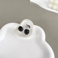 Macro detail of glossy black cherry phone grip with silver leaves on an iridescent base - Irregular Ring Stand - White Flash - Cherry