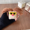 Close-up of funny plush phone grip with big mouth and sunglasses on wooden desk - Brown Heart Sunglasses Style