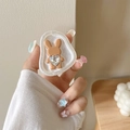 Close-up of hand holding a cute brown rabbit phone stand with a large heart crystal - Irregular Base White Sparkle Rhinestone Rabbit - Brown