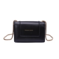Minimalist black square crossbody bag with gold chain strap and fashion lettering - Black