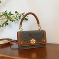 Vintage retro crossbody bag featuring brown leather trim and intricate woven wave patterns - Black
