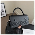 Detail view of the black contrast stitching crossbody bag with checkered texture pattern - Black