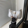 Minimalist silver metallic shoulder bag with golden buckle and sleek rectangular design - Silver