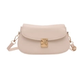 Beige saddle bag with pebble leather texture and gold-tone metal clasp closure - White