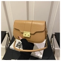 Detail of khaki crocodile pattern crossbody bag featuring a golden square metal clasp - Khaki