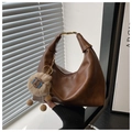Detail of vintage brown hobo bag with gold metal handle and sheep plush charm - Brown with Pendant
