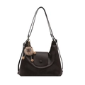 Minimalist brown leather tote bag with a cute plush doll charm on a clean white background - Bag / Brown