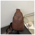 Detail of dark brown PU leather crossbody bag with silver zipper and woven strap - Coffee