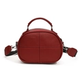 Red pebbled leather crossbody bag with wide black and white strap and top handle - Red