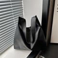 Minimalist black leather hobo tote bag with a wide strap and a natural slouchy shape - Black