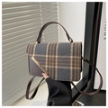 Detail of plaid wool and brown leather crossbody bag with elegant gold metal trim - Brown